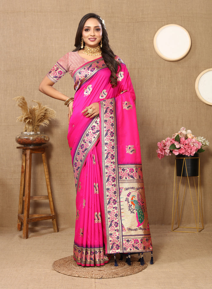 Elegant bright-pink silk saree with intricate zari border and stylish tassels, ideal for festive occasions.