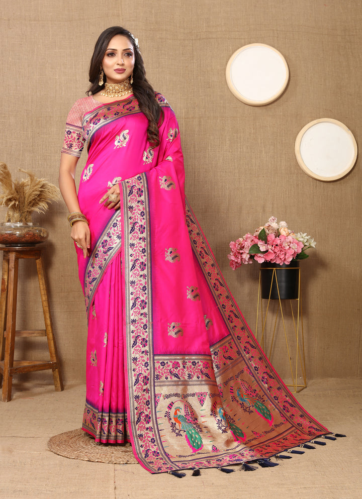 Timeless bright-pink Paithani silk saree with beautiful zari border and chic tassels, perfect for cultural events.