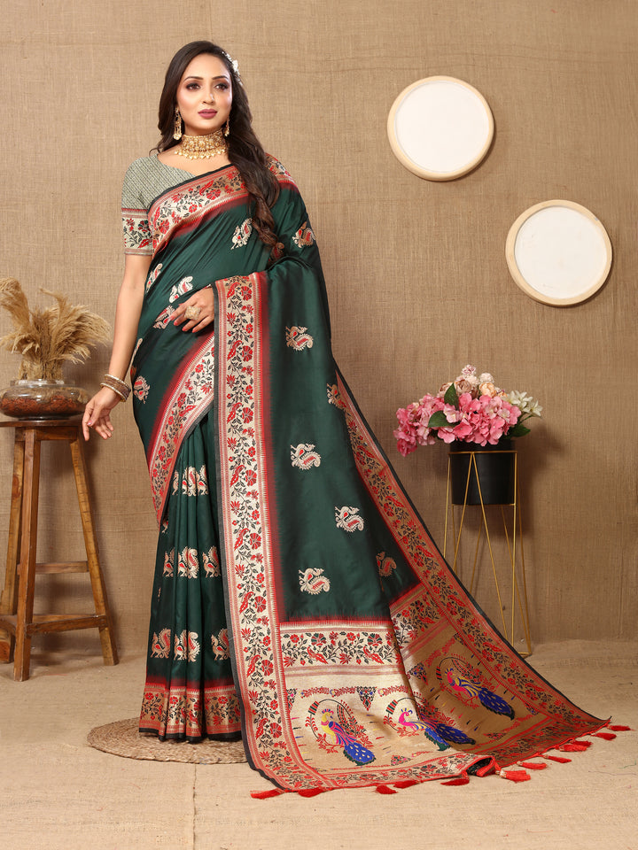 Timeless teal-green silk saree with luxurious zari border and stylish tassels, perfect for traditional events.