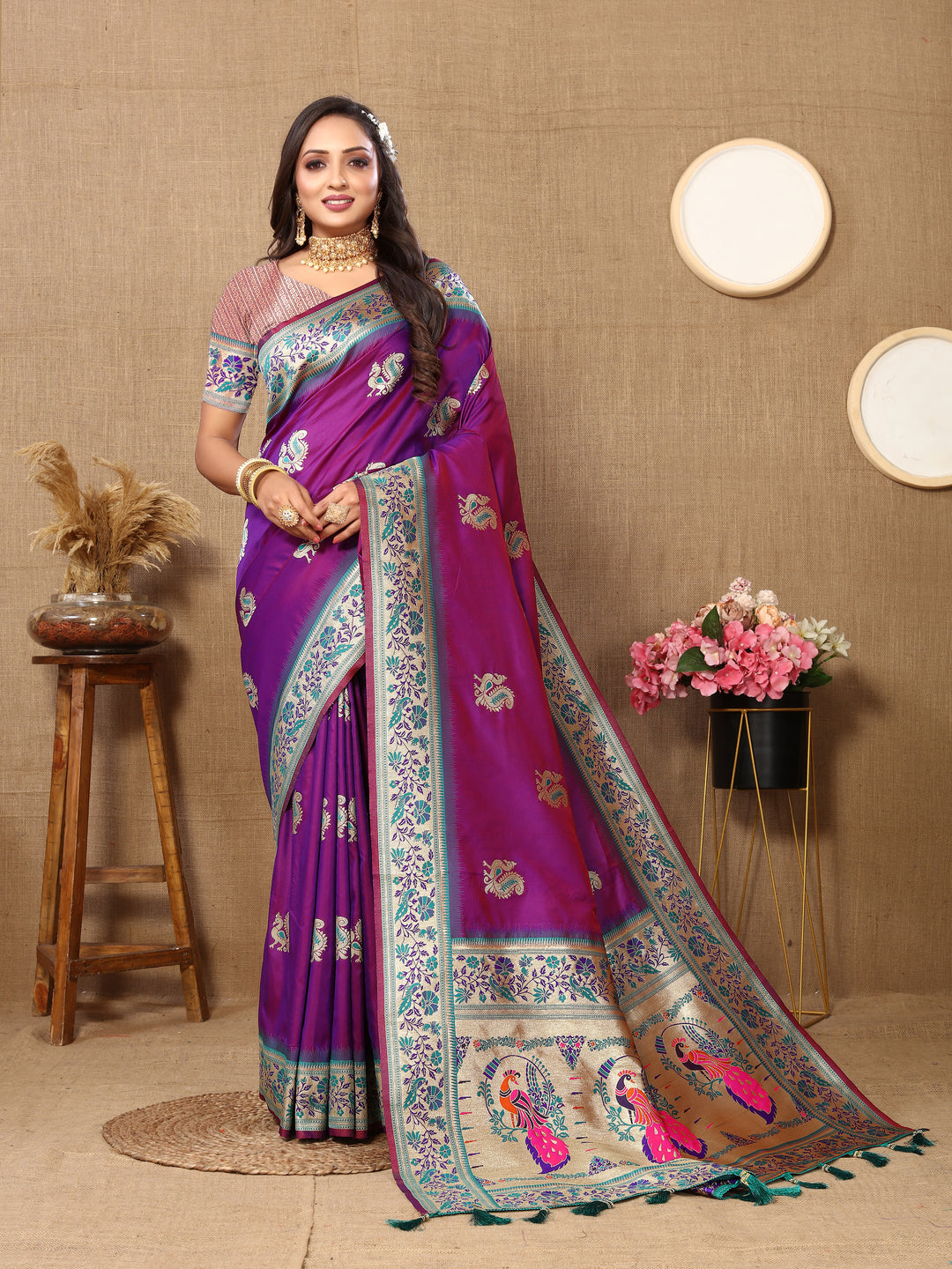 Purple silk saree with beautiful zari border and tassels, perfect for cultural gatherings.