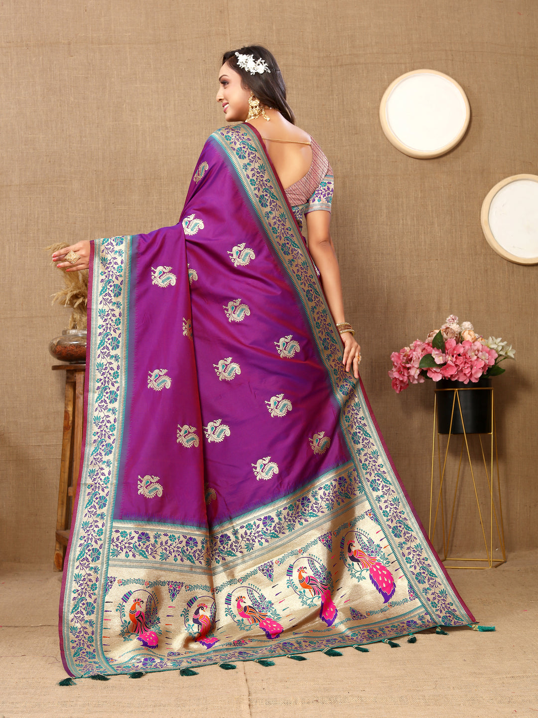 Sea-blue Paithani silk saree with beautiful zari border and chic tassels, perfect for weddings.