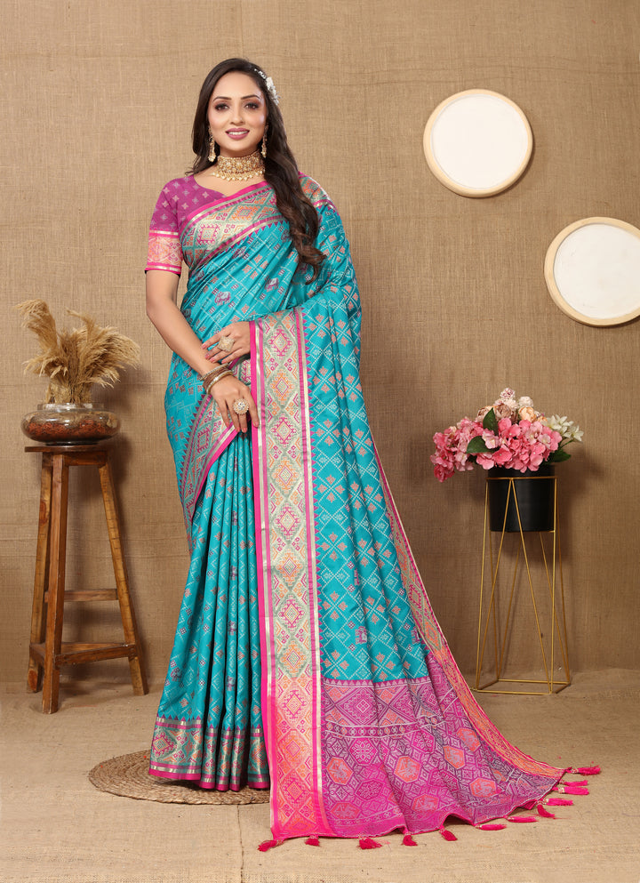 Stylish sky blue Patola silk sari featuring intricate zari detailing and a detailed pallu, ideal for weddings.