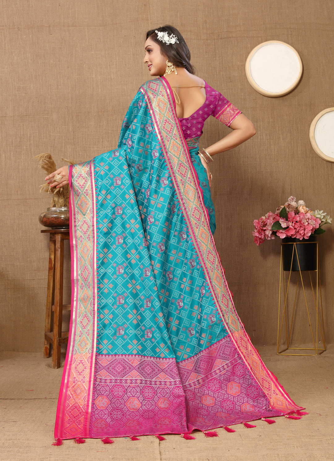 Luxurious sky blue Patola silk sari with intricate pallu details and shimmering zari, ideal for special occasions.