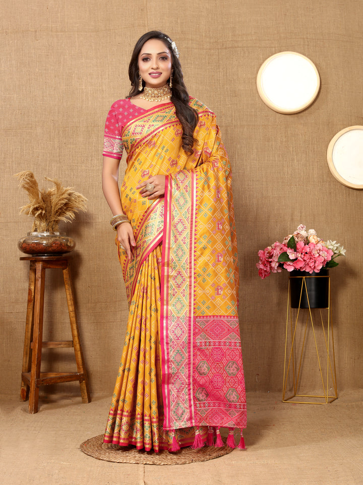 Elegant yellow Designer Patola silk sari with rich zari and intricate pallu, ideal for traditional occasions.