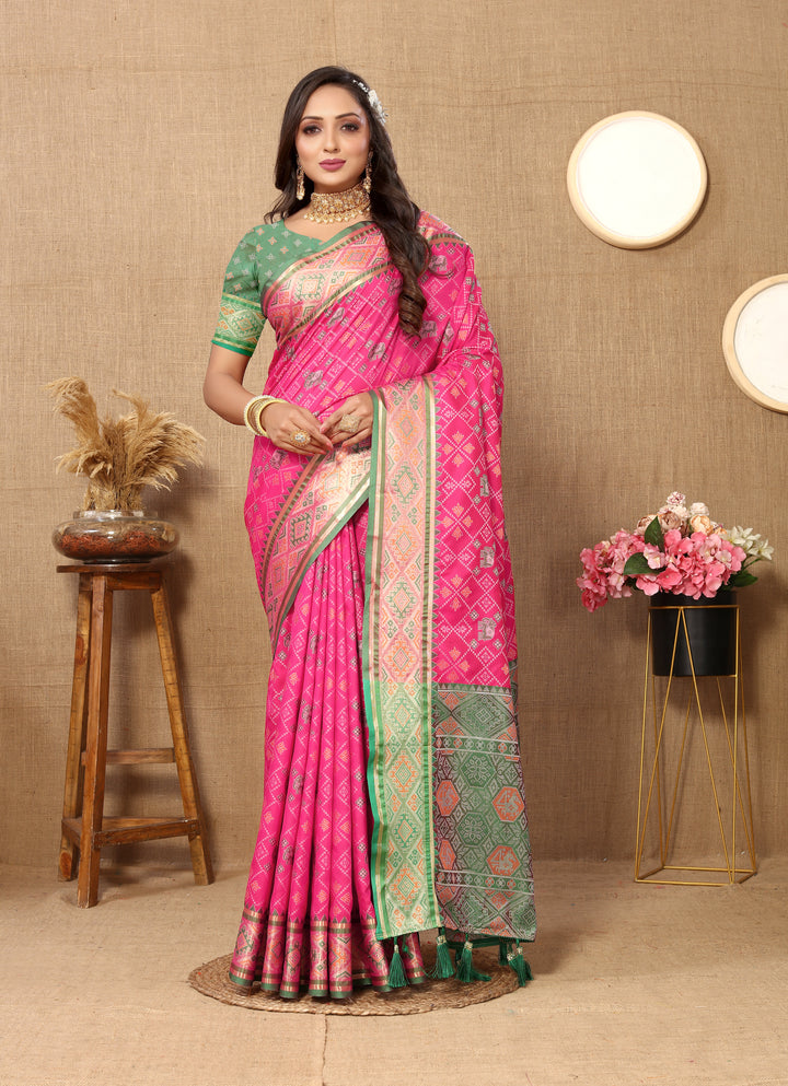 Pink Designer Patola silk sari with rich zari and detailed pallu, perfect for weddings and events.