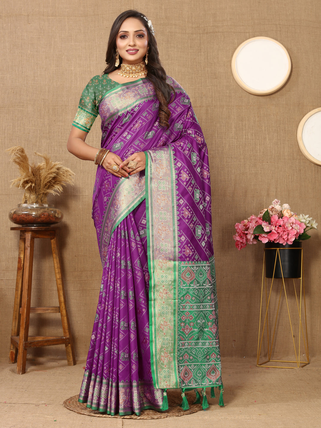 Rich purple Patola silk saree with exquisite Meenakari and zari motifs, perfect for grand weddings and festive occasions.