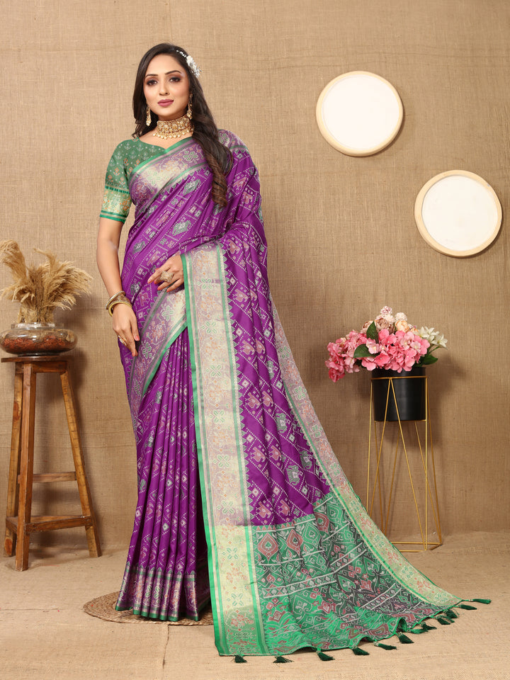 Elegant purple Patola silk saree featuring Meenakari motifs and intricate zari accents, ideal for cultural events.