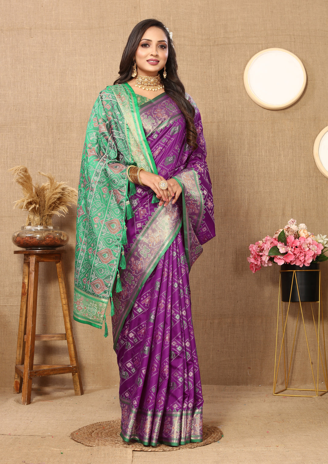 Stunning purple saree in Patola silk with Meenakari and zari details, complemented by a silk blouse piece.