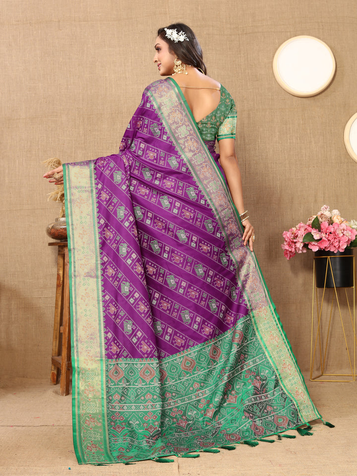 Gorgeous purple Patola silk saree with traditional Meenakari and zari detailing, ideal for cultural celebrations.