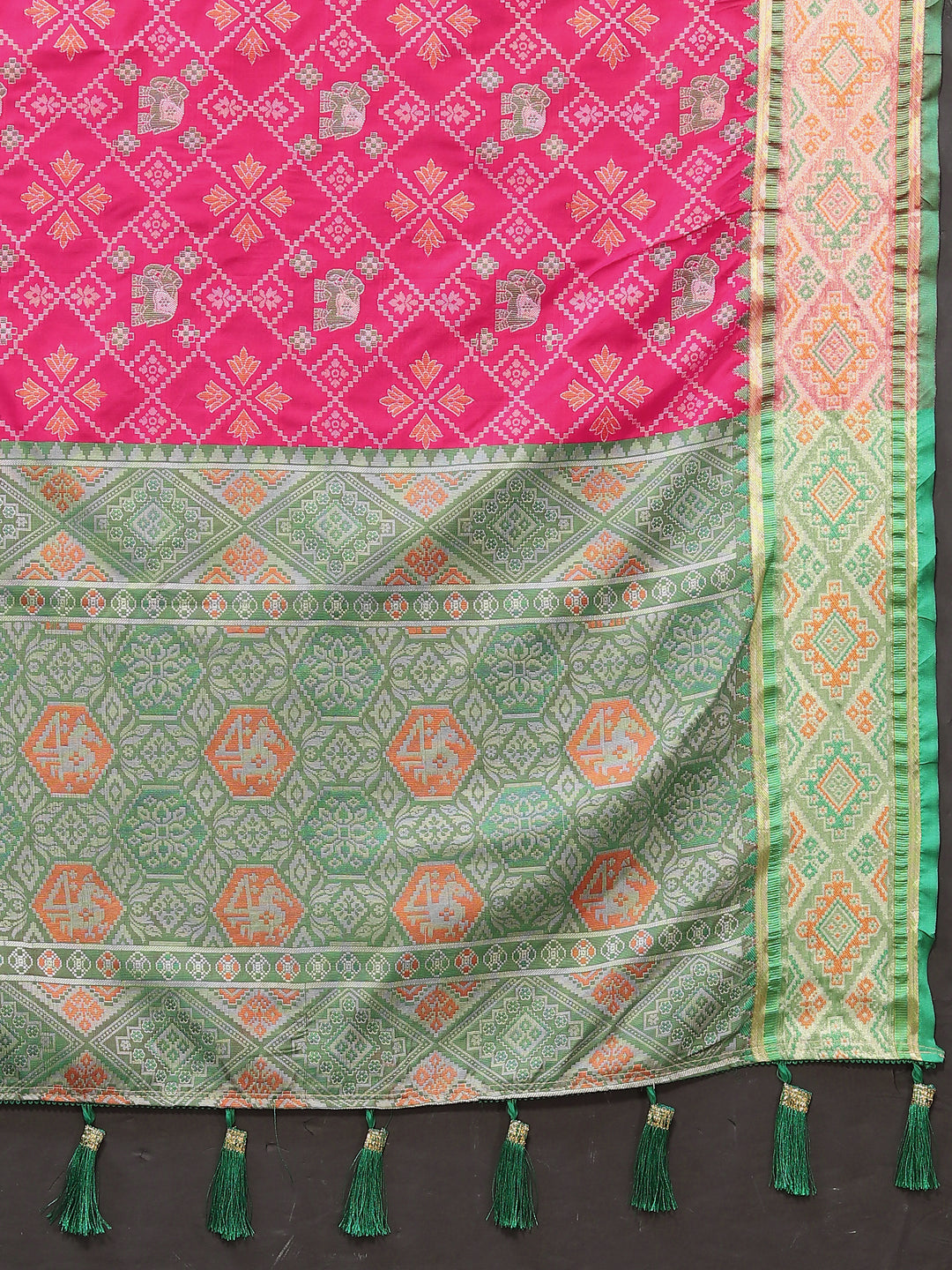 Sophisticated pink Designer Patola silk sari with rich zari pallu, perfect for formal events.