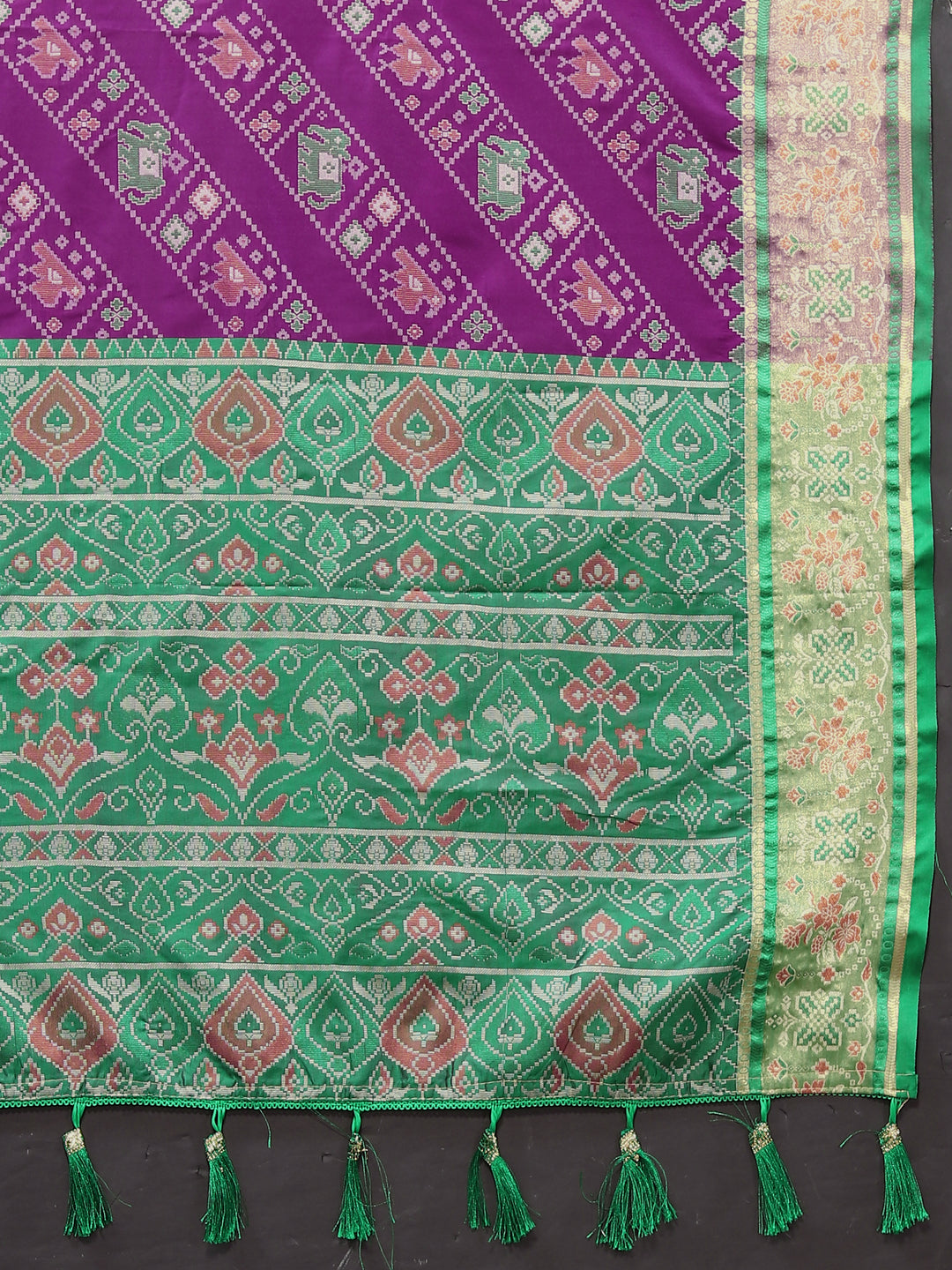 Timeless purple Patola silk saree with intricate Meenakari and zari accents, ideal for weddings and special events.