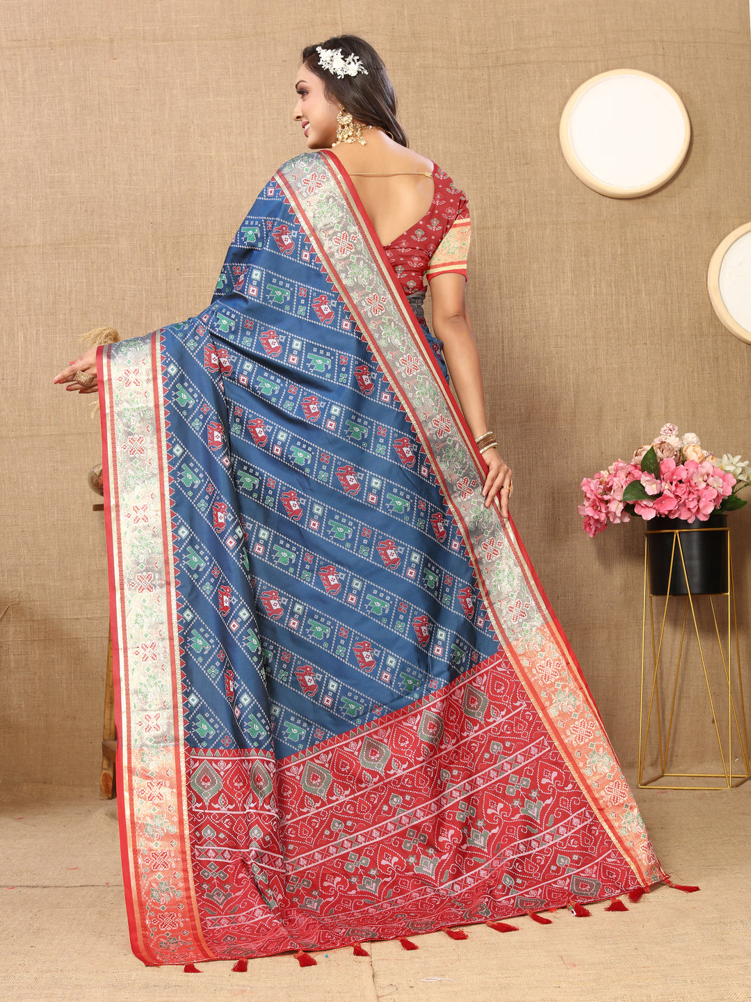 Gorgeous teal blue saree in Patola silk with Meenakari detailing and intricate zari work, perfect for weddings.