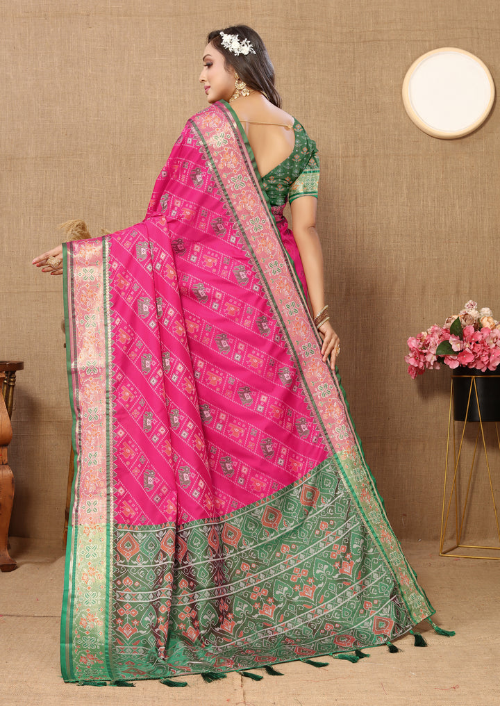 Stunning pink Patola silk saree featuring rich Meenakari weaving and zari accents, ideal for traditional celebrations.