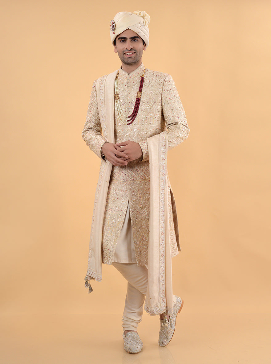 Elevate your wedding attire with this beige silk sherwani, showcasing intricate embroidery and a perfect fit, blending tradition with modern style for your special day in the USA.