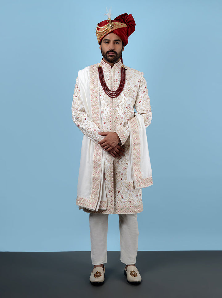 Fashionable cream sherwani with intricate embroidery, ideal for elegant events and celebrations.