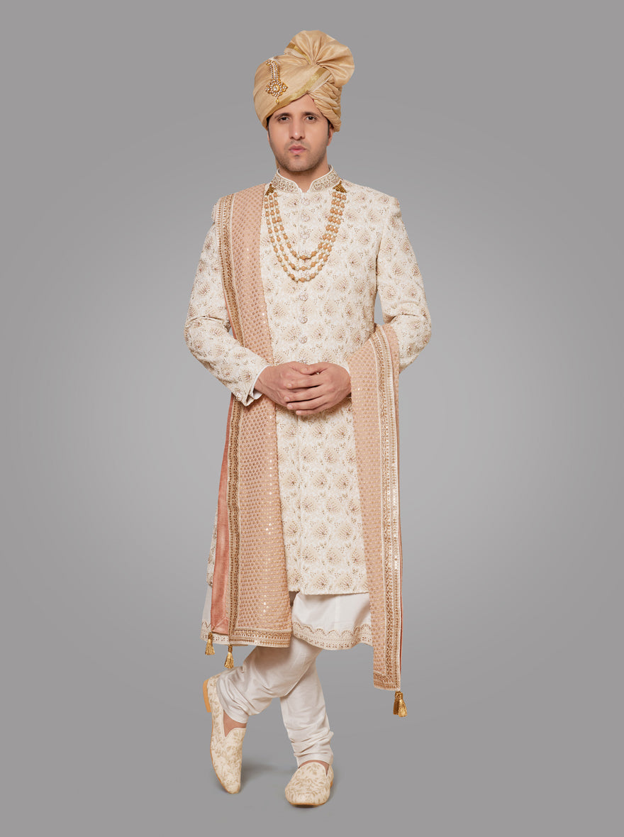 Elevate your wedding attire with this beautifully crafted off-white sherwani, tailored for sophistication.