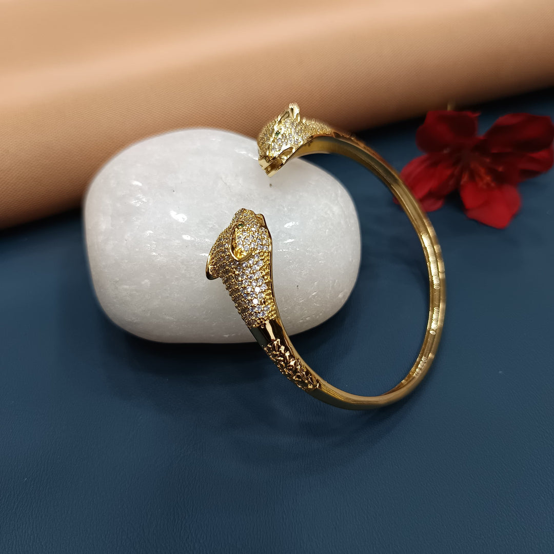 Stylish golden bracelet with a heart charm, perfect for gifts.