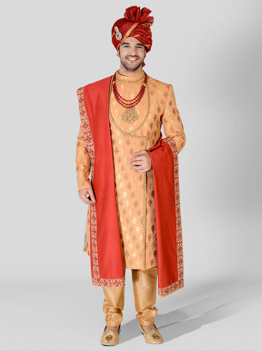 Step into elegance with our Orange & Golden Sherwani, crafted from luxurious silk fabric.