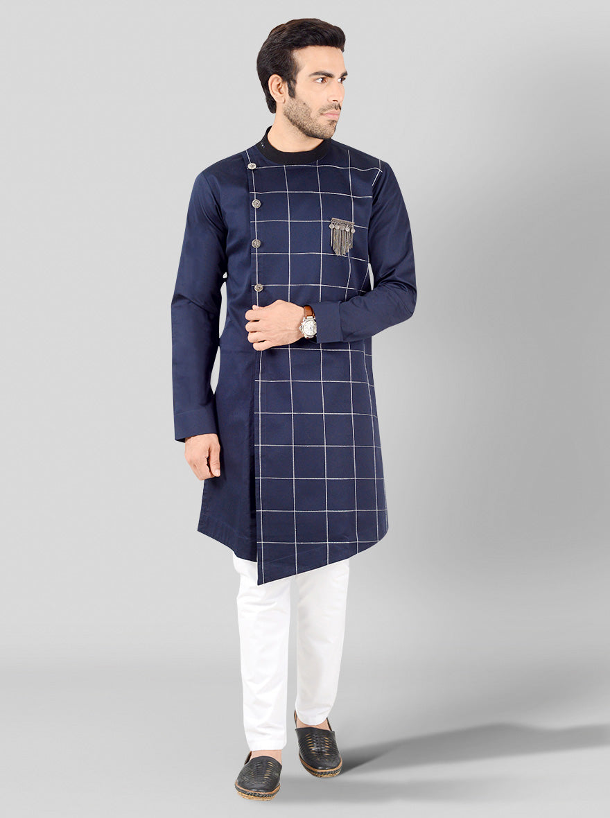 Stylish navy blue kurta for men featuring check embroidery and an asymmetric hemline, perfect for festive occasions.