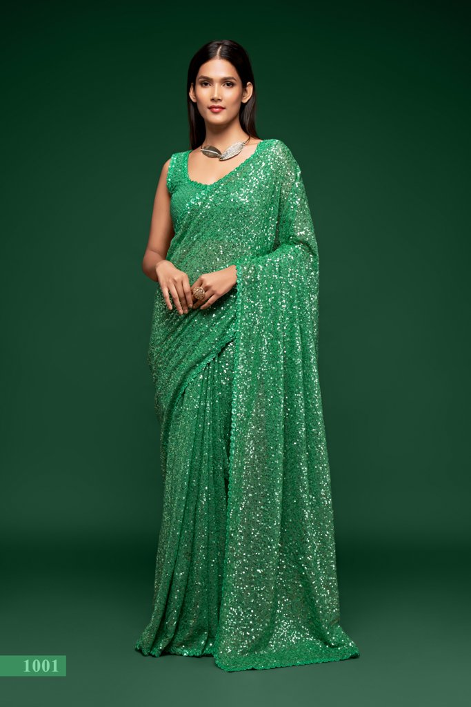 A stunning mint green saree adorned with intricate sequins embroidery, perfect for festive occasions and as a designer saree for Indian weddings.