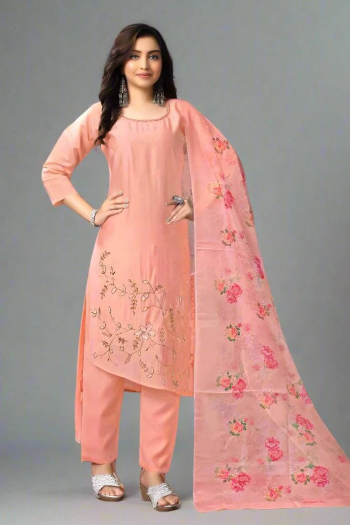 Chic peach kurta with matching pant and dupatta, crafted from soft Roman silk for a graceful look.