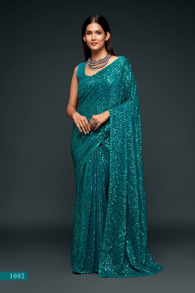 A stunning teal saree featuring intricate sequins embroidery, perfect for any occasion as a designer saree or Indian wedding saree.