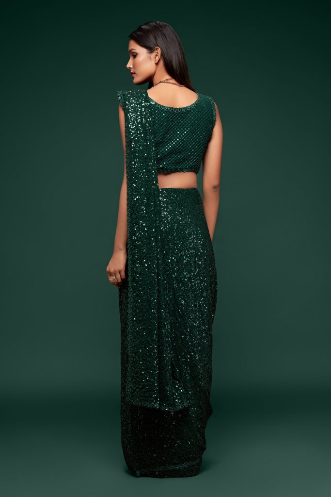 Stunning dark green sadi with intricate sequins embroidery, a stylish choice for special occasions and gatherings.