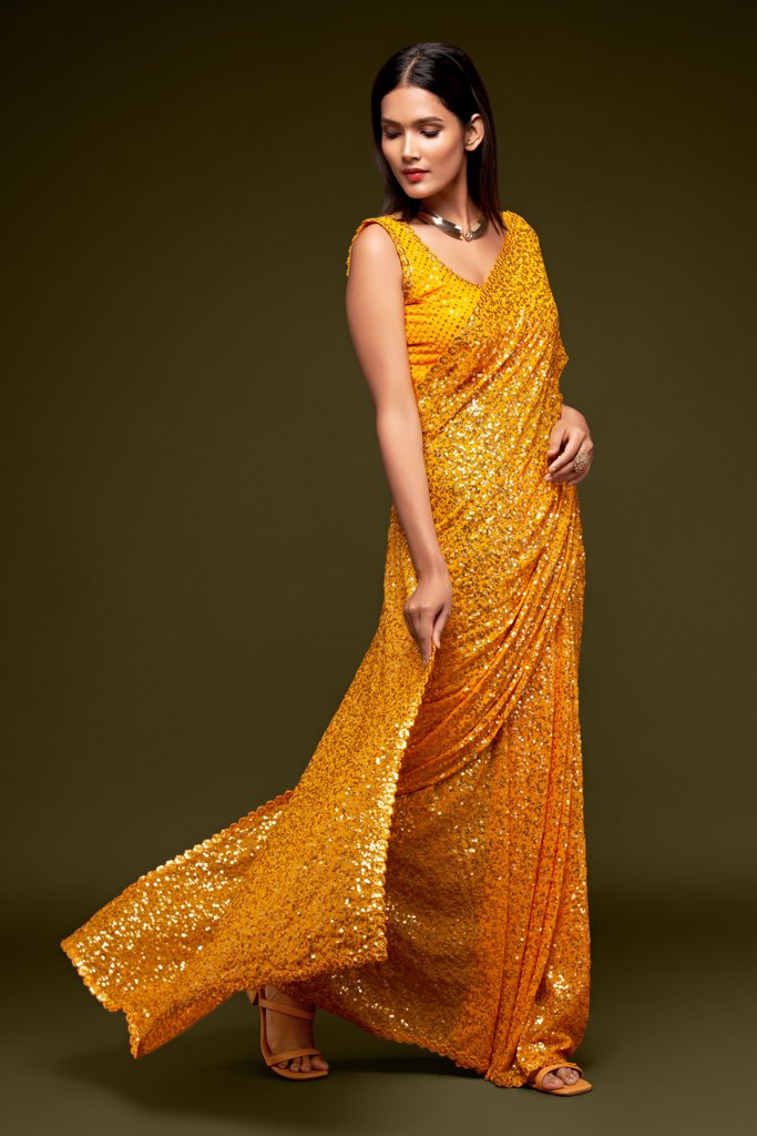 Eye-catching yellow Indian saree adorned with exquisite sequins, designed to stand out at any event as a fancy saree.