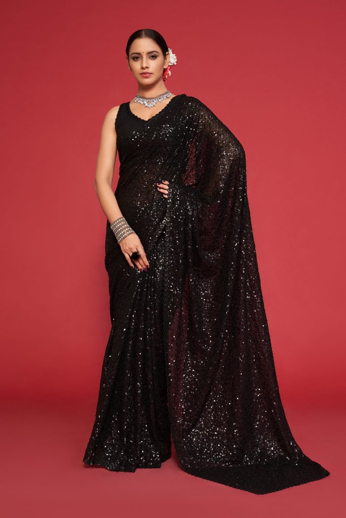 A chic black faux georgette saree with intricate sequins embroidery, perfect for glamorous occasions and as an Indian wedding saree.