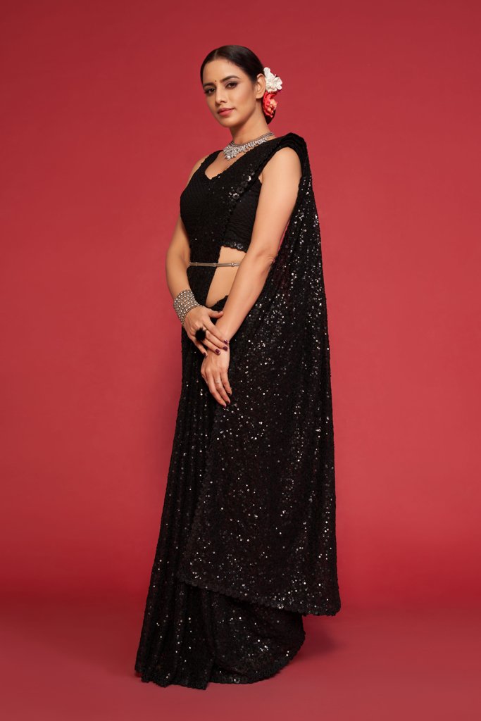 Timeless black Indian saree adorned with exquisite sequins work, ideal for weddings and festive celebrations among fancy sarees.