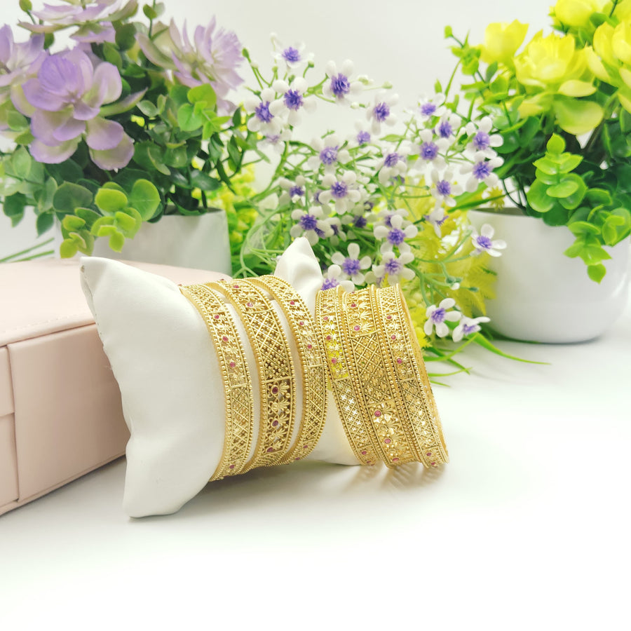 Elegant golden bangles with minimalist aesthetics for a modern vibe.