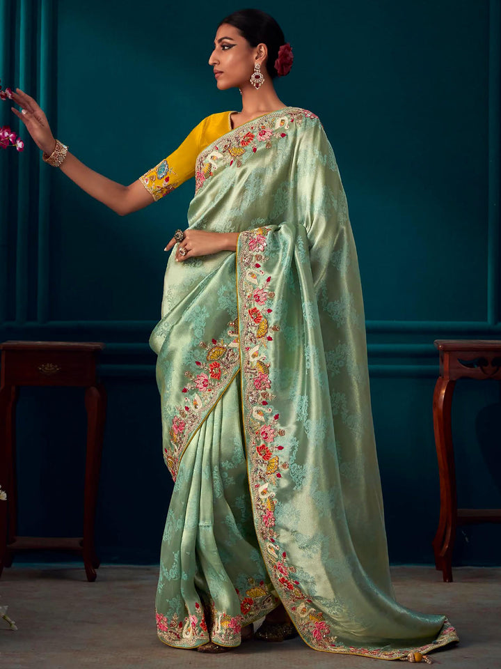 Green silk saree crafted for elegance and style.