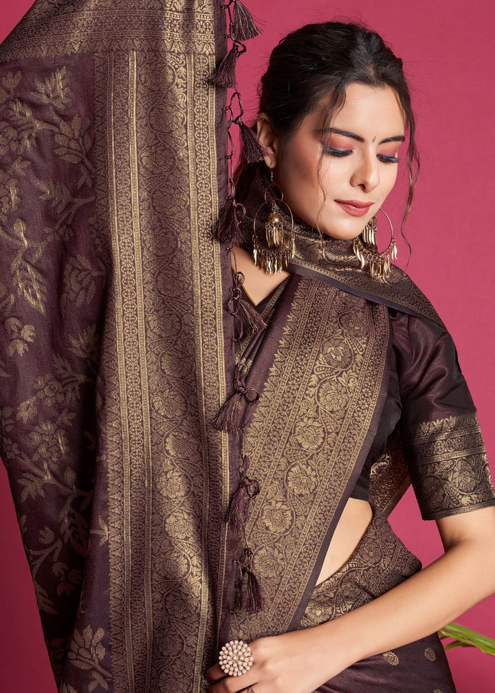 A stunning Wine fancy saree with intricate zari details and fancy tassels, perfect for any festive occasion or wedding.