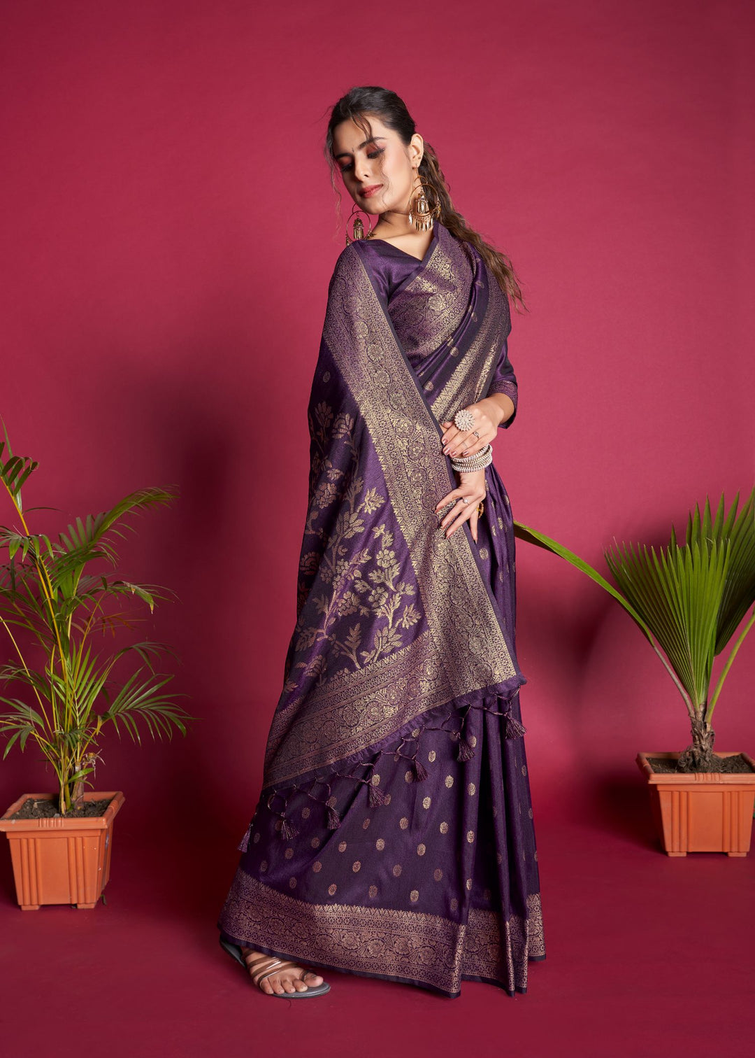 Celebrate your heritage in this purple Indian sari, featuring a beautiful zari border and fancy tassels, ideal for weddings.