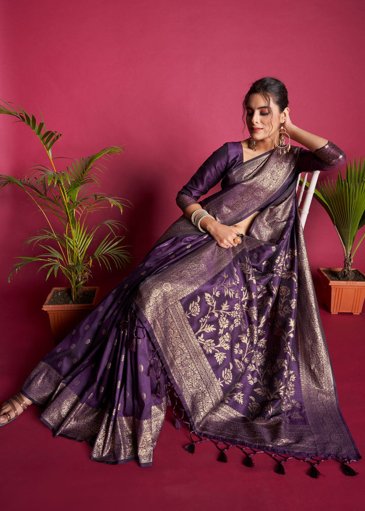 Make a statement with this luxurious purple Designer saree, crafted from Banarasi raw silk with intricate zari weaving.