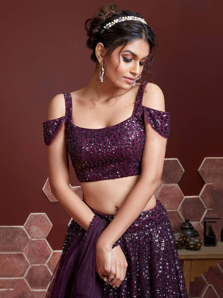 Purple lehenga with net silk material and intricate sequins embroidery.