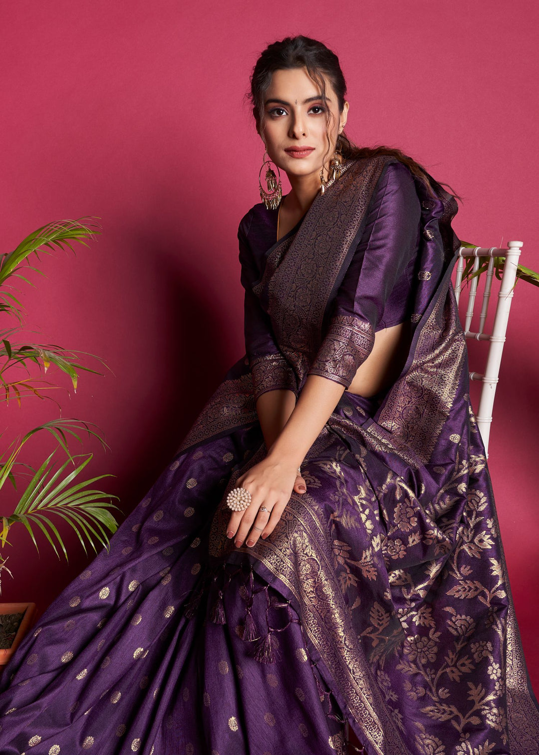 This purple traditional Indian sari is a perfect blend of elegance and festivity with its rich zari work and fancy tassels.