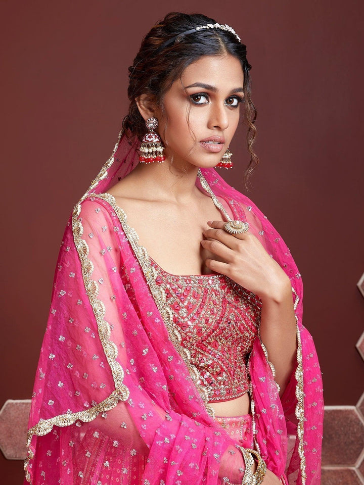 Elegant pink lehenga with heavy embroidery and digital print design.