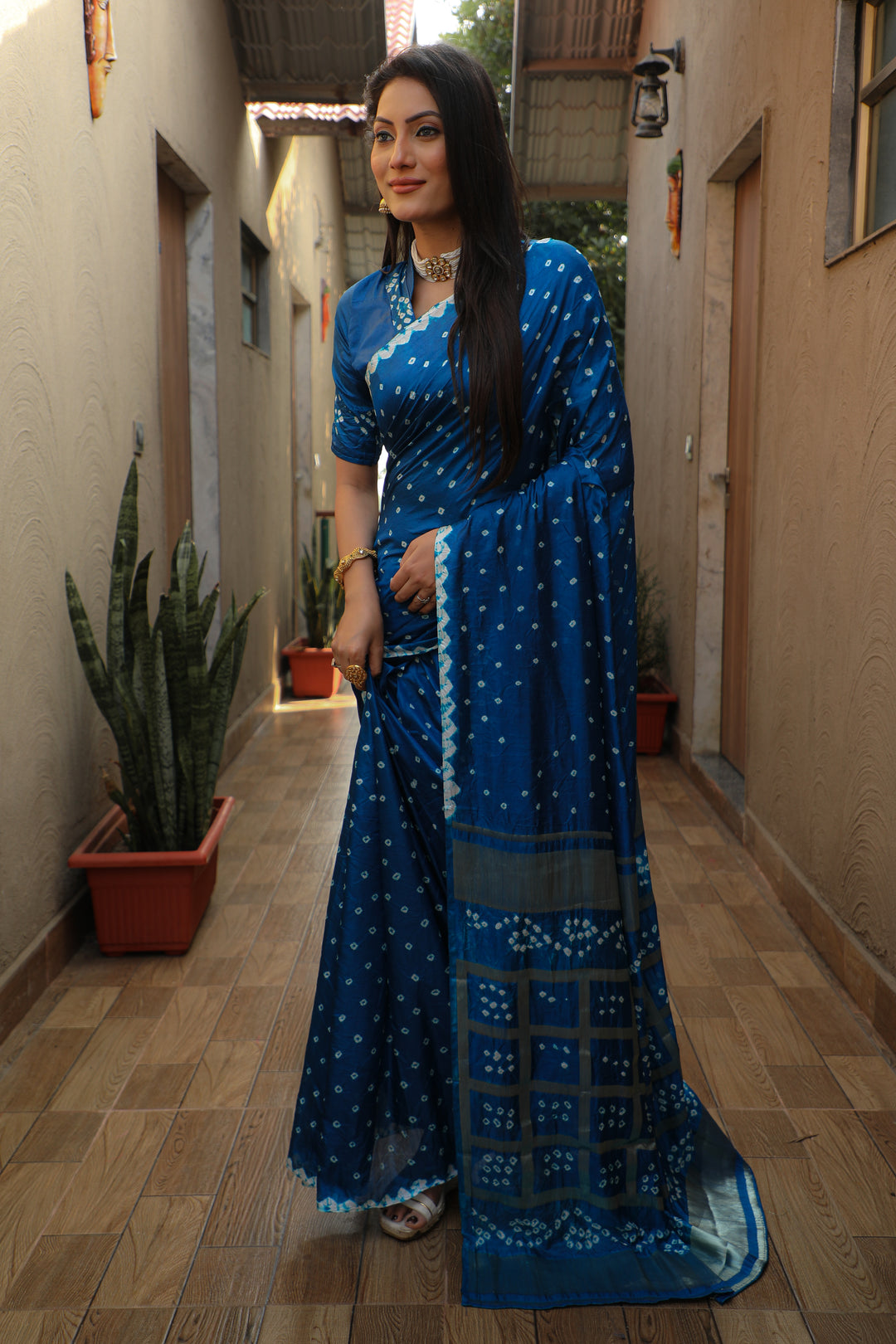 Traditional royal-blue Bandhej silk saree with beautiful checks design and original craft.