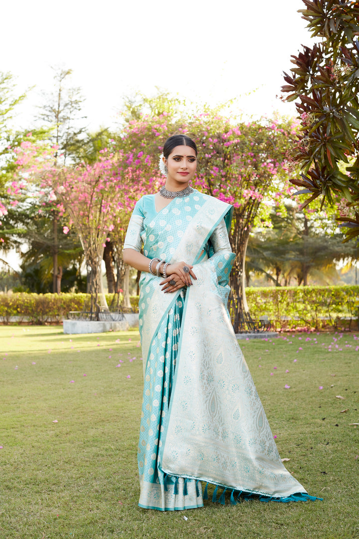 Green Kanjivaram saree with a satin finish and intricate butta work, creating a stunning look for special occasions.