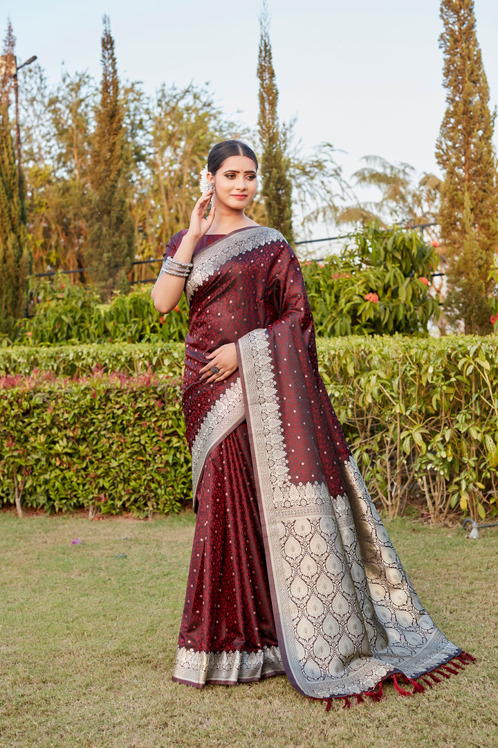 Stunning Wine Kanjivaram Silk Saree with beautiful Butta design and intricate designer border for traditional events.