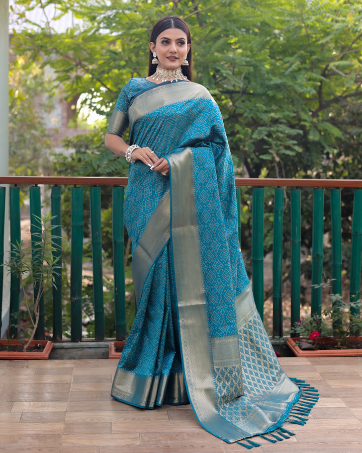 Richly detailed blue Bandhej silk saree with all-over zari work, reflecting India's traditional heritage.