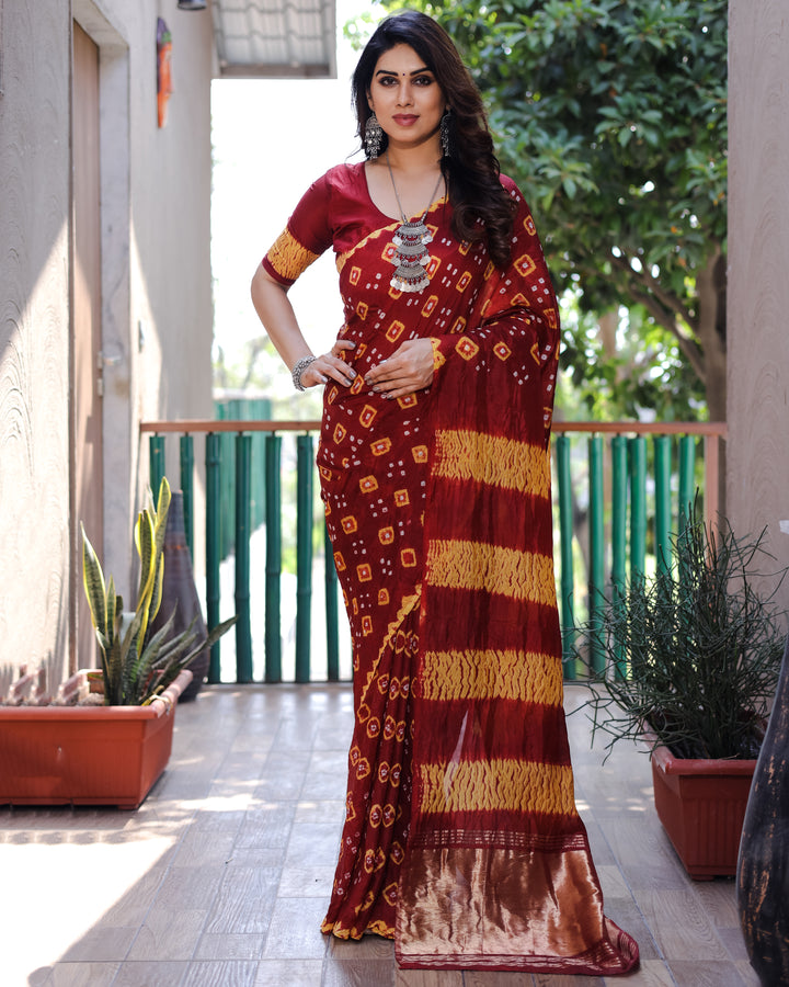 Elegant maroon Bandhej silk saree with delicate Zari and Sibory motifs, ideal for special gatherings and celebrations.