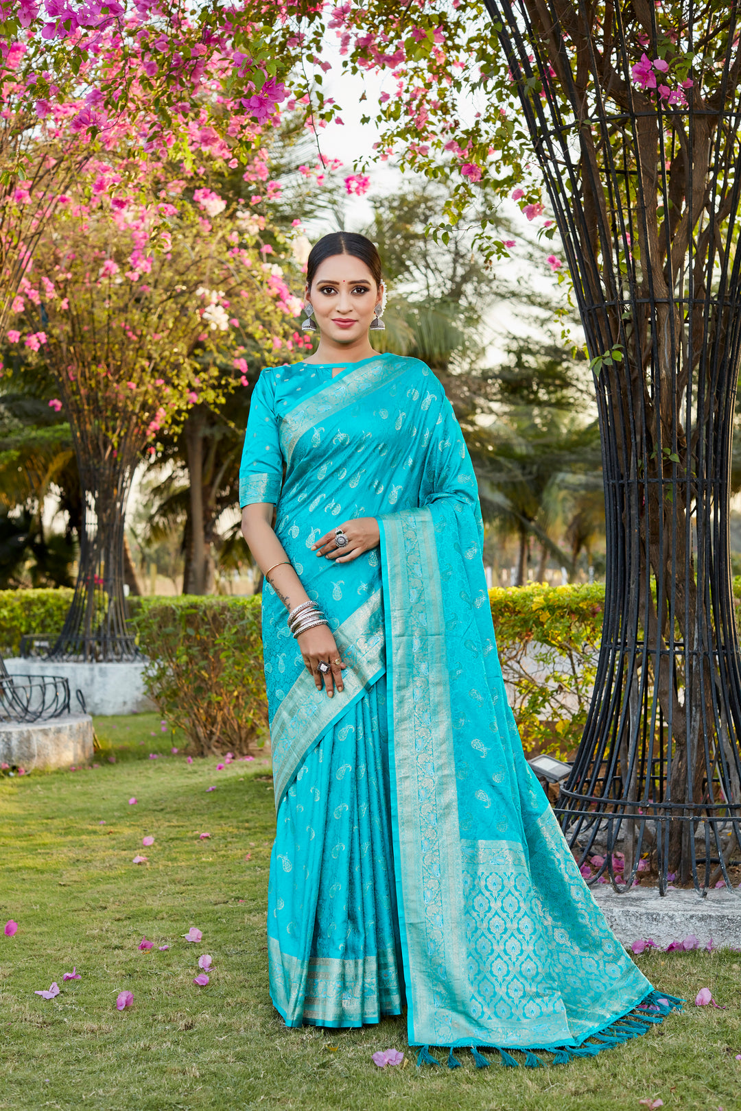 Timeless sky-blue satin silk Kanjivaram saree with intricate butta and woven pallu, perfect for formal events.