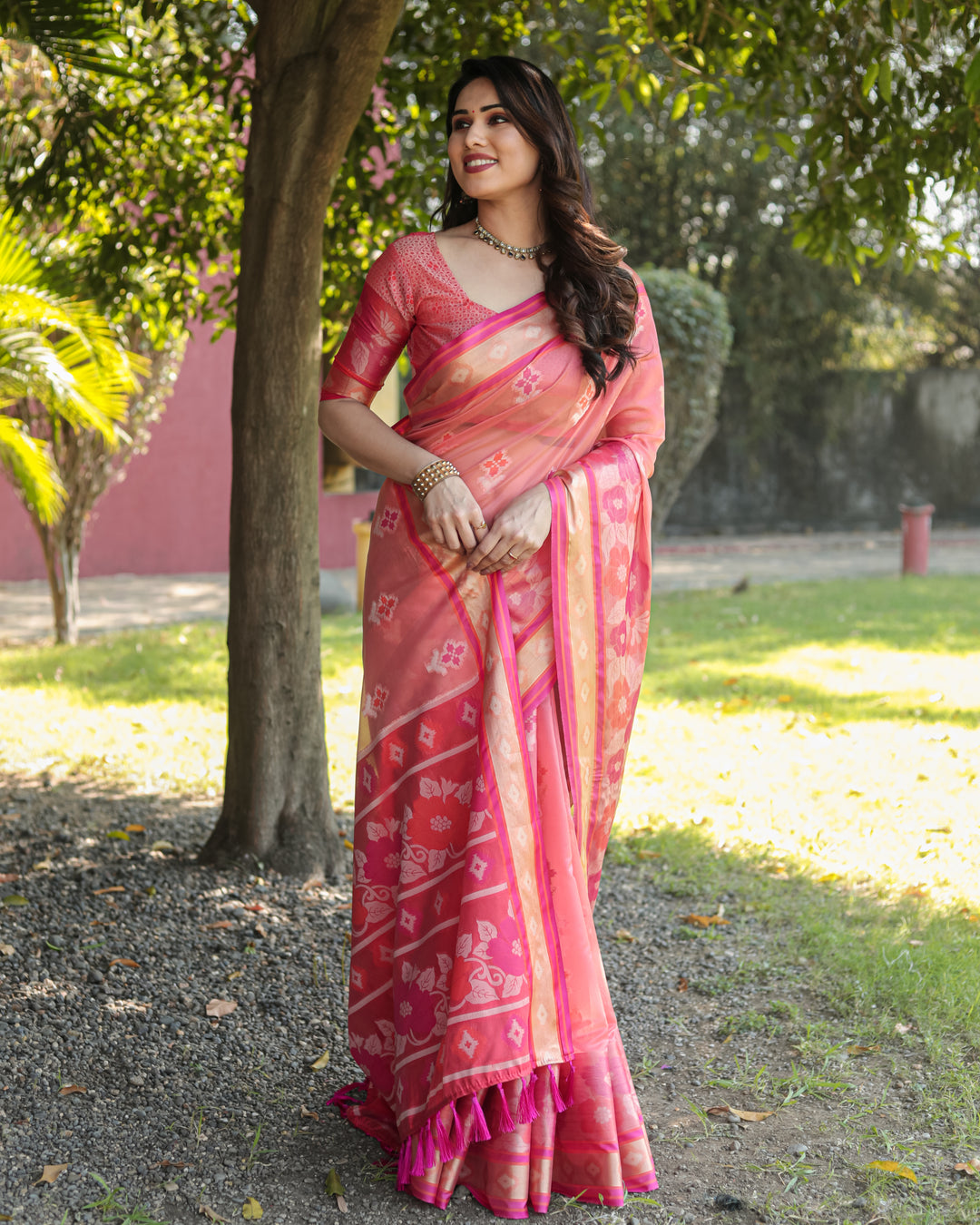 Stunning pink Organza Ikkat saree with rich weaving details, perfect for elegant and casual wear.