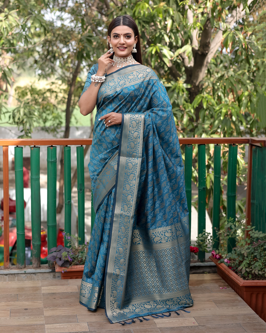 Timeless maroon Bandhej Patola silk saree with delicate zari work and Kanchi borders, perfect for elegant occasions.