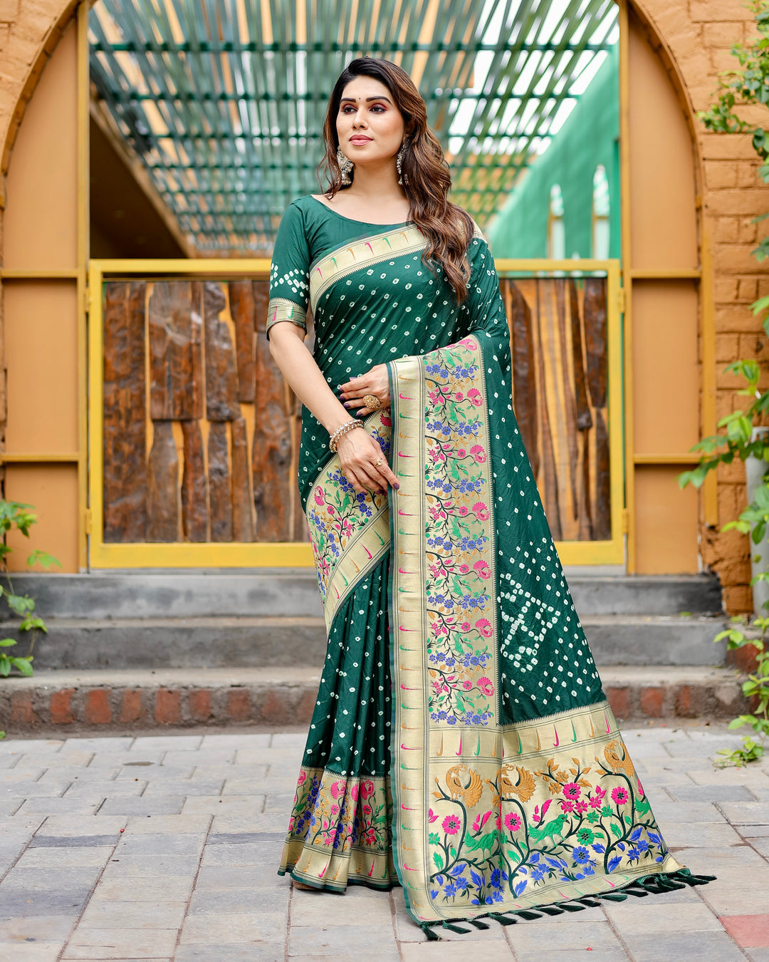 Dark green Paithani Bandhej silk saree with zari weaving and a rich pallu, perfect for adding elegance to any occasion.