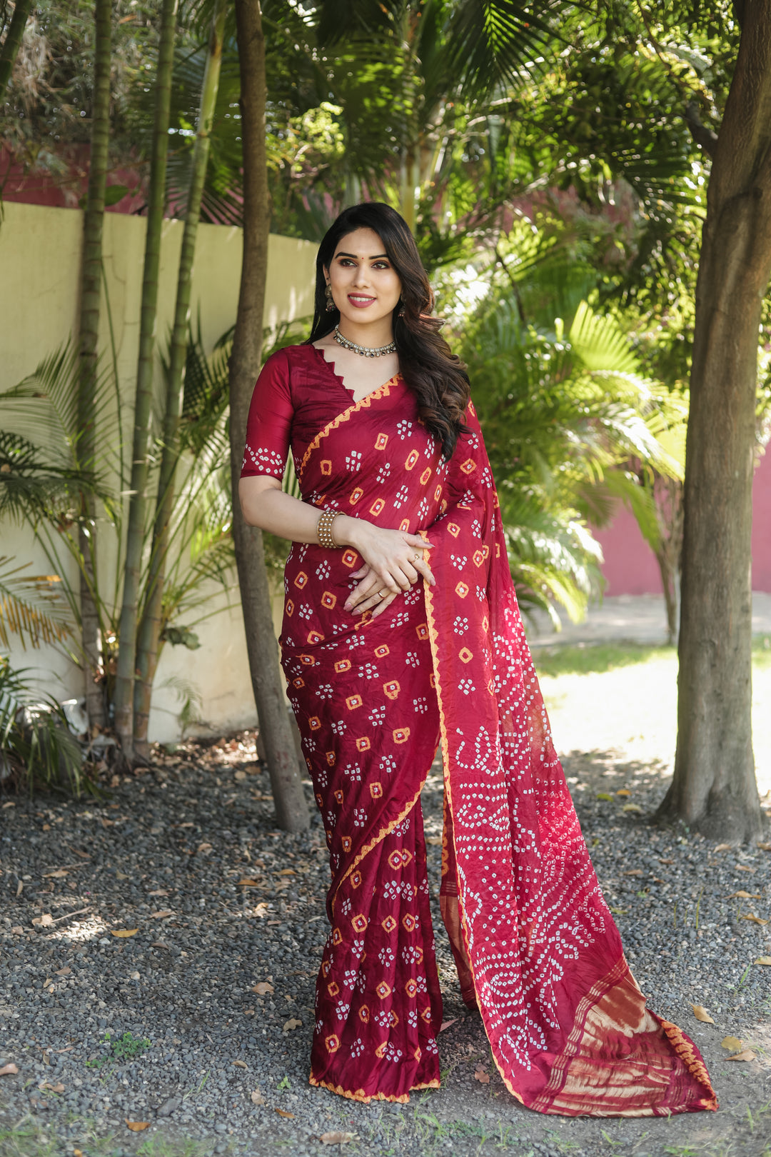 Rich Bandhej silk saree with vibrant tissue pallu and detailed zari weaving.