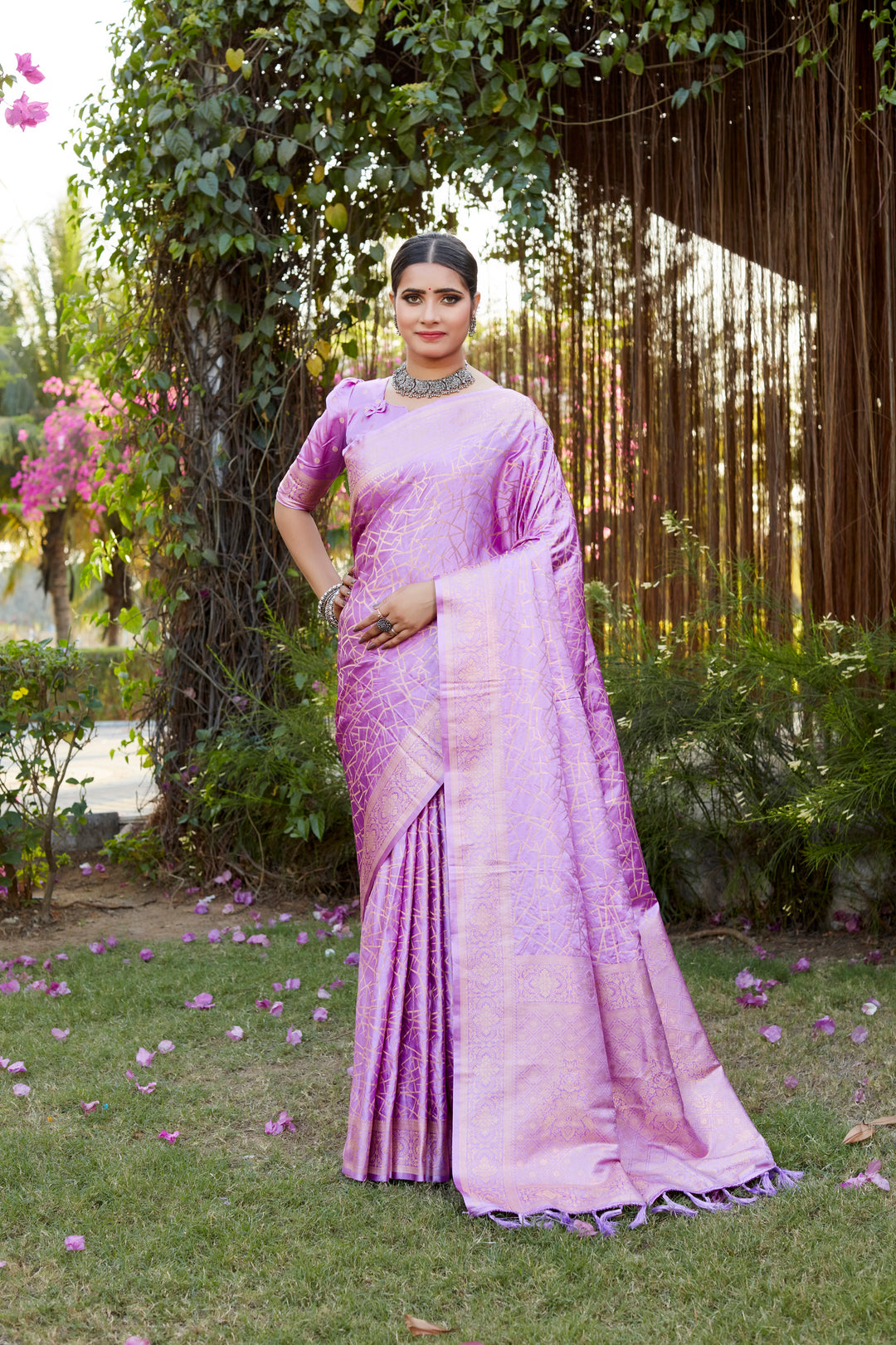 Beautiful pink Kanjivaram soft satin silk saree with detailed butta work, ideal for bridal wear and elegant occasions.