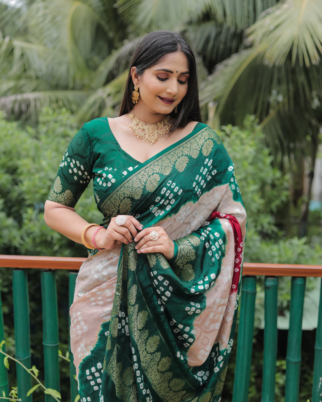 Rich Green Pure Bandhej Silk Saree with designer zari border, ideal for festive occasions.